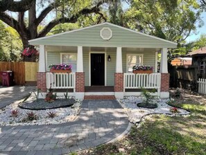 Charming single-story house with a gabled roof and inviting front porch.