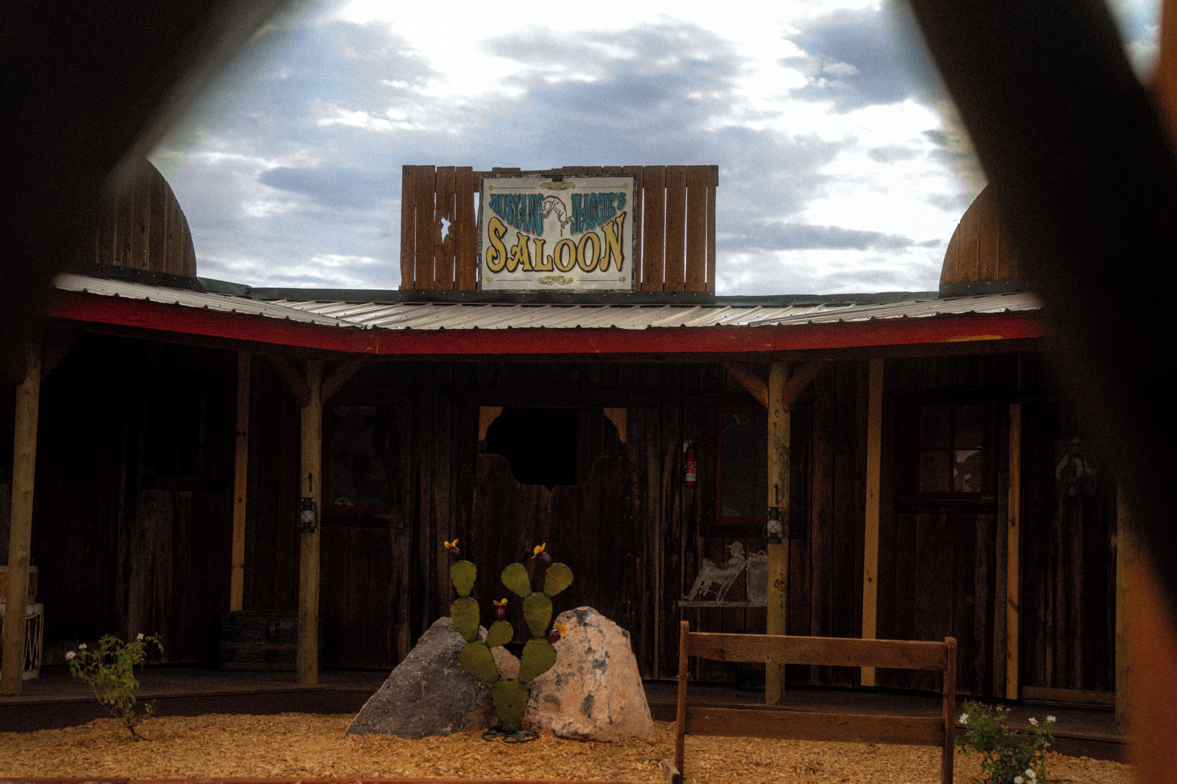 A rustic building with a sign reading "Museum of the West's Saloon."