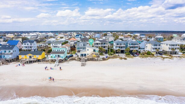 A coastal residential area with beachfront properties, a sandy beach, and a view of the ocean. - "Island Time", Peaceful 5BR Oceanfront Cottage (Surf City)