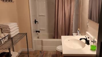 Combined shower/tub, hair dryer, towels, soap
