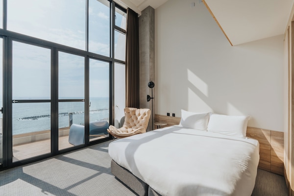 Signature Loft, Balcony, Ocean View | Down comforters, blackout drapes, free WiFi, bed sheets