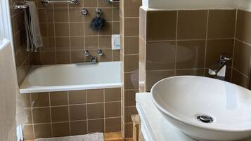 Combined shower/tub, hair dryer, towels, soap
