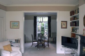 TV, fireplace, books, printers
