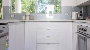Coffee/tea maker, fridge, microwave, oven