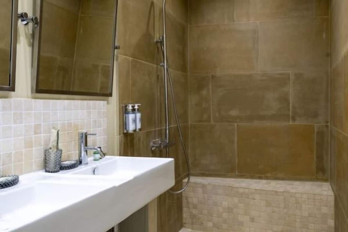 Separate tub and shower, designer toiletries, hair dryer, bathrobes
