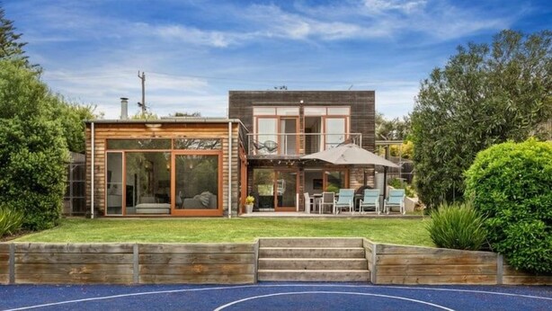 A modern two-story house with a patio area, a basketball court, and a well-maintained garden. - Sorrento Sea Escape. (Sorrento)