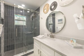 Shower, hair dryer, towels, toilet paper