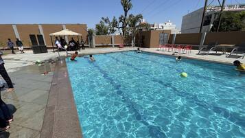 Outdoor pool, pool umbrellas, sun loungers