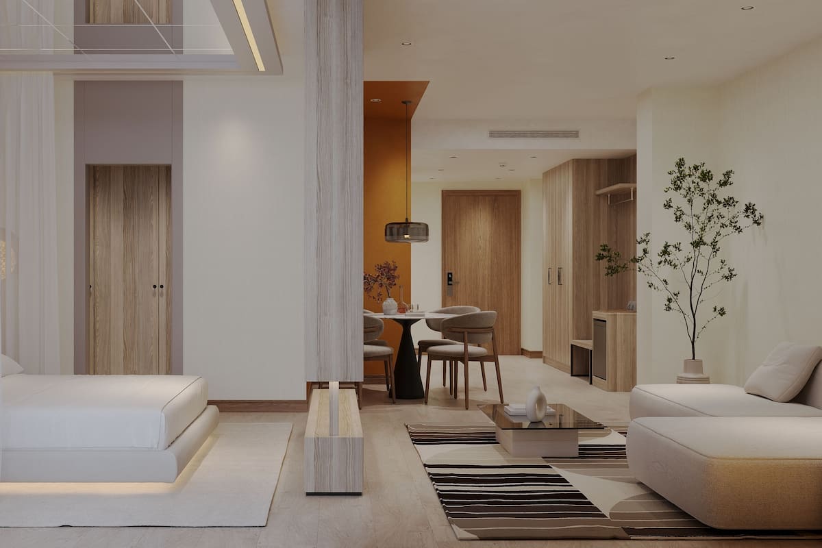 A modern living room with a sofa, a coffee table, and a dining area with chairs and a table.