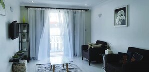 Living area - Modern, Stylish & Homely Apt w/wifi*pool*gardens (Kampala)