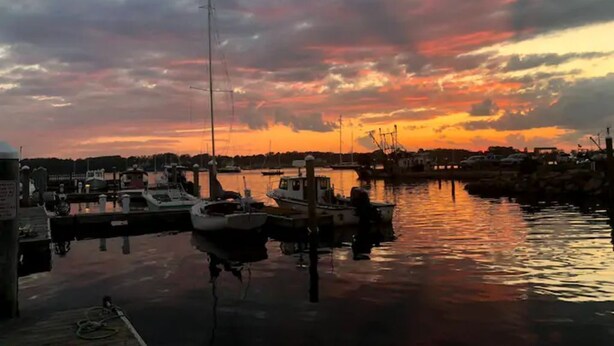 A marina with boats docked at the pier during sunset. - Located close to wedding venues, university, shops and eateries and Newport.   (Bristol)