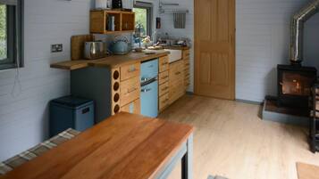 Cabin, 1 Queen Bed | Private kitchen | Fridge, stovetop, toaster