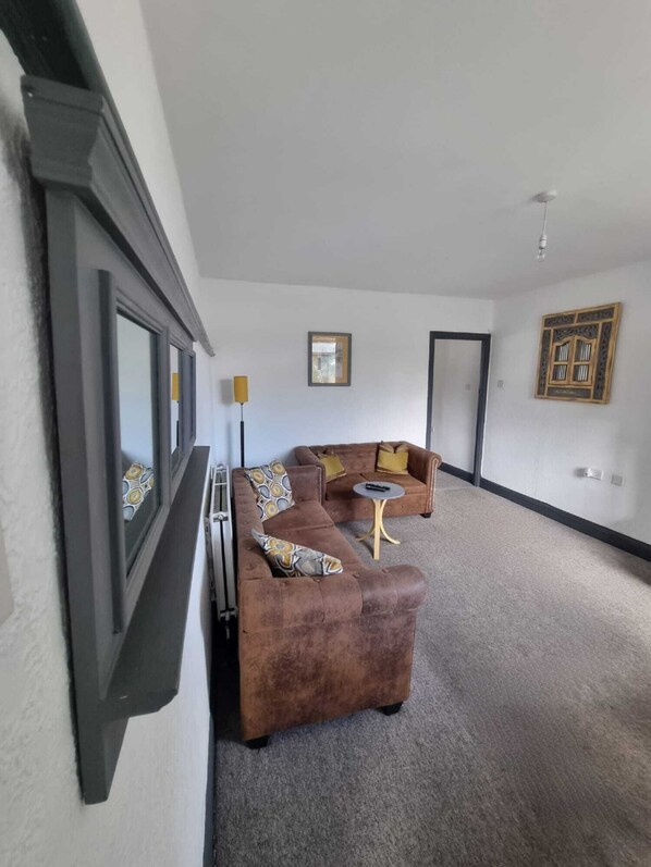 Standard Apartment | Living area | 14-inch Smart TV with cable channels, TV