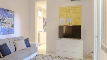 Luxury Apartment in Via delle Ruote | Living area | 44-inch flat-screen TV with digital channels, TV