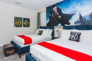 A hotel room with two beds, a large poster of a wizard, and two framed emblems on the wall. - Last Minute Disney! Private Pool, Game Room & Themed Bedrooms. Book Now! #29216 (Orlando)
