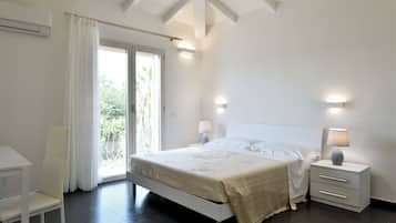 Habitación superior | Ropa de cama de alta calidad y edredones de plumas