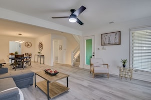 Signature Townhome, 3 Bedrooms, Balcony, River View | Living area | 65-inch Smart TV with cable channels, TV, fireplace