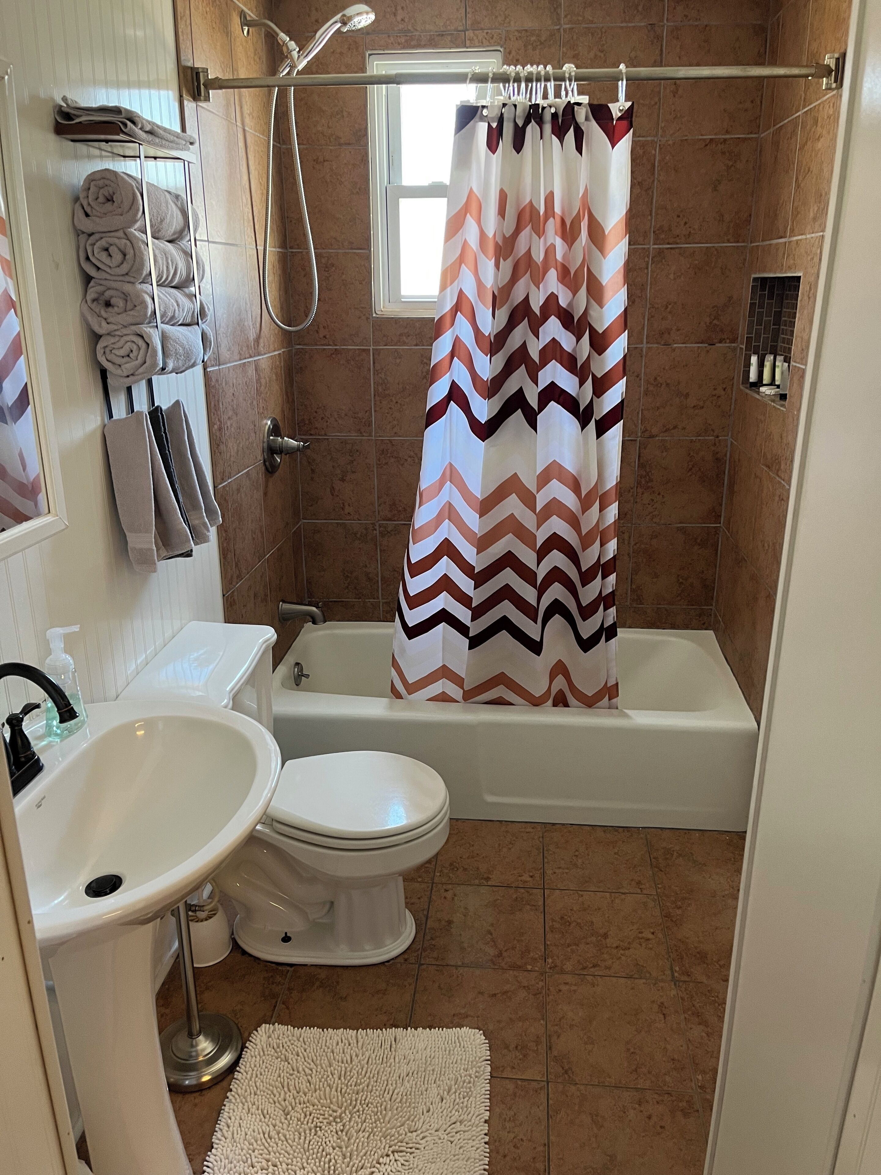 Combined shower/tub, hair dryer, towels, soap