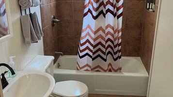 Combined shower/tub, hair dryer, towels, soap
