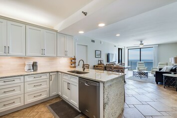 Fully renovated kitchen with granite countertops and stainless steel appliances