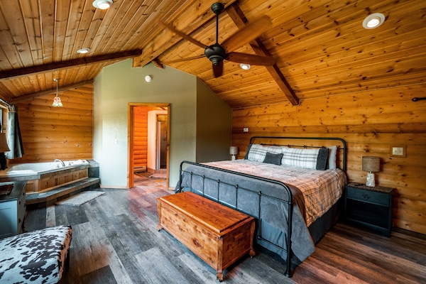 Master bedroom suite with jacuzzi and fireplace