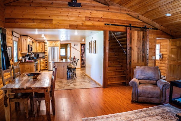 View from Great Room into kitchen. Stairs go to Master Bedroom Suite.
