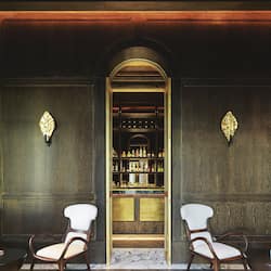 Relax in the bar area with comfortable seating and a well-stocked bar counter.