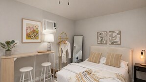 A bedroom with a bed, bedside table, lamp, and a ceiling fan.