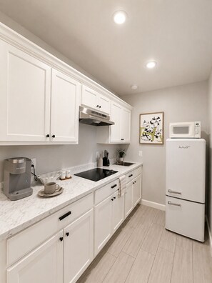 Fridge, microwave, stovetop, coffee/tea maker