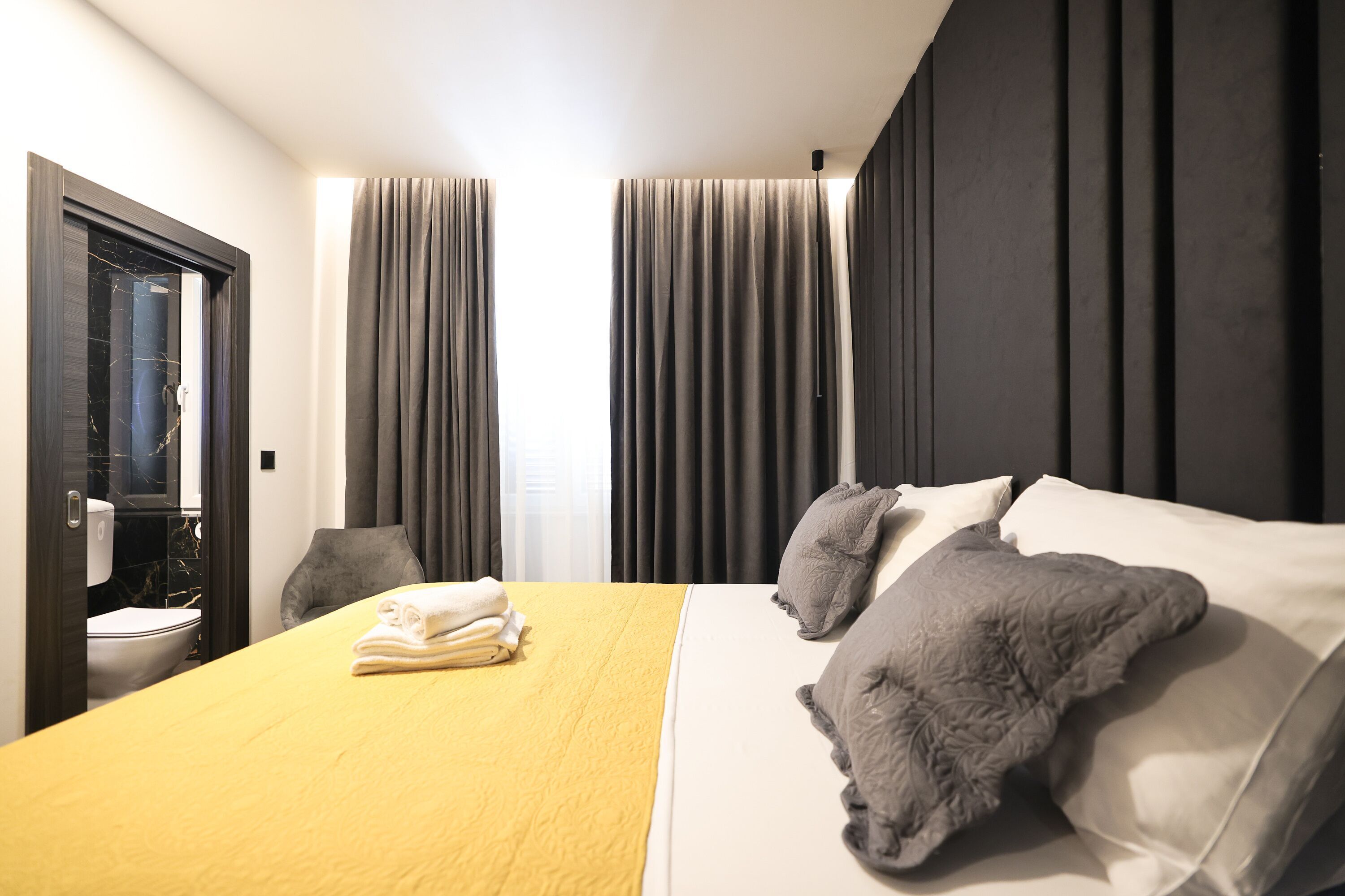 Premium bedding, memory-foam beds, desk, laptop workspace