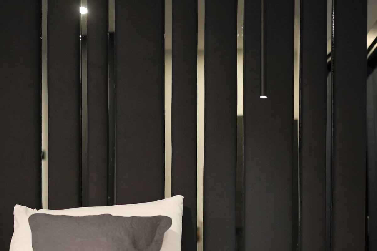 Premium bedding, memory-foam beds, desk, laptop workspace