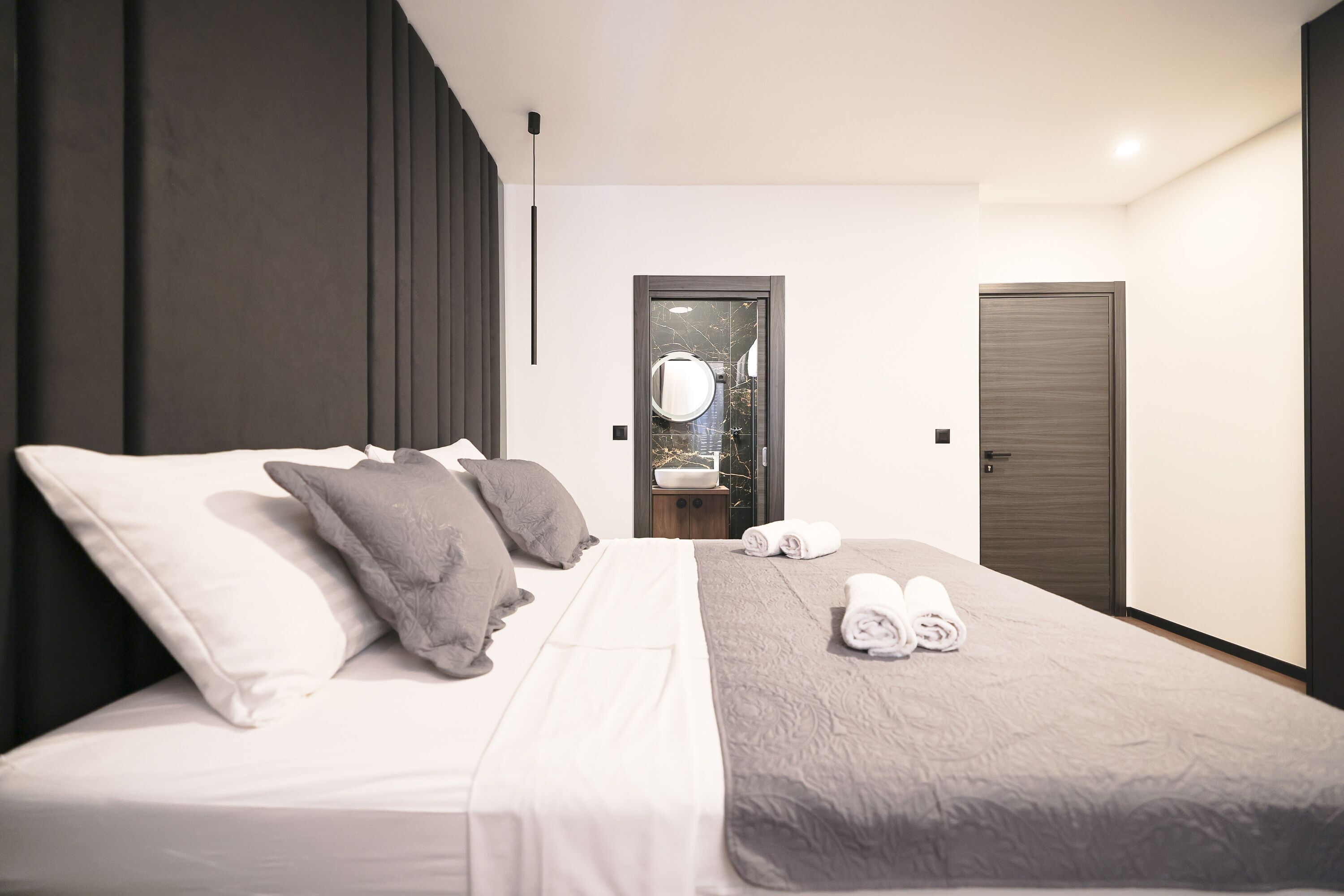 Premium bedding, memory-foam beds, desk, laptop workspace