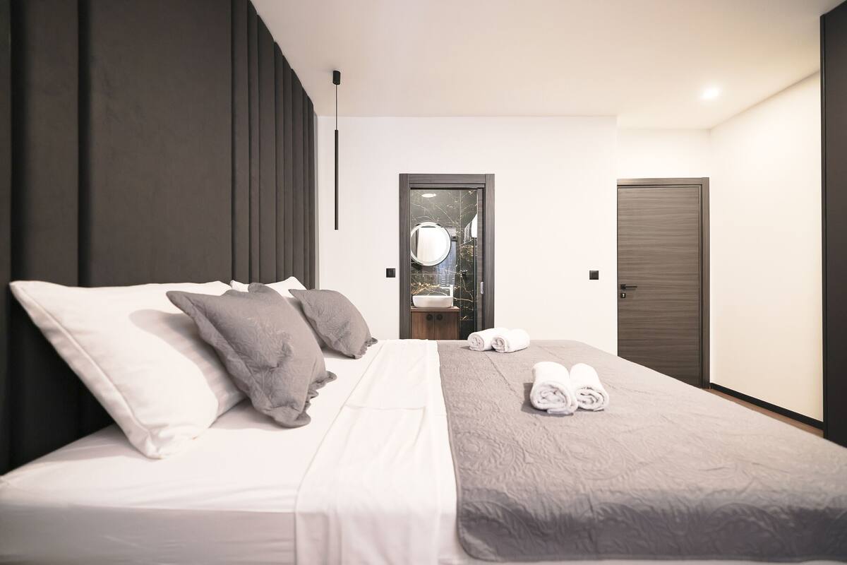 Premium bedding, memory-foam beds, desk, laptop workspace
