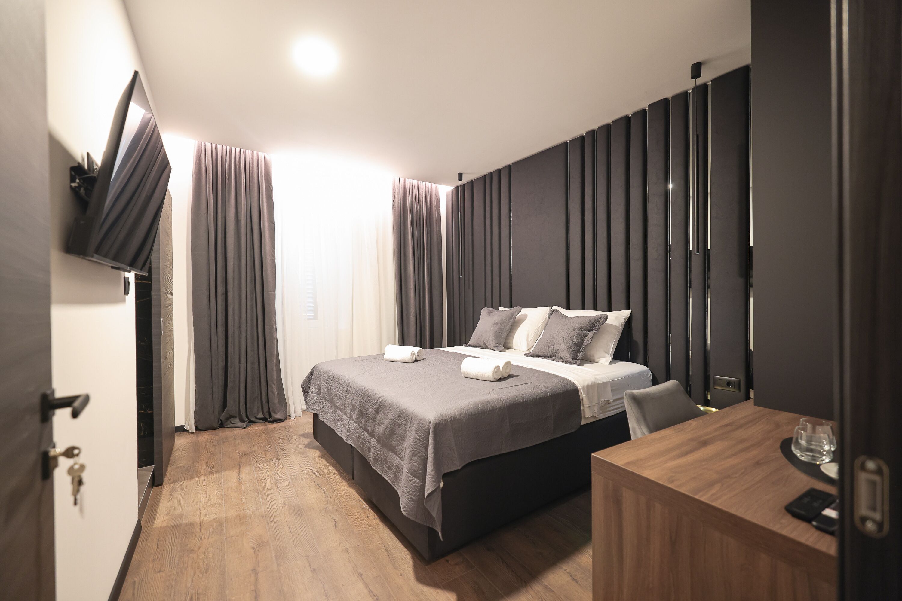Premium bedding, memory-foam beds, desk, laptop workspace