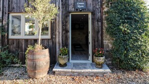 A rustic wooden building with a sign reading "Games Room".