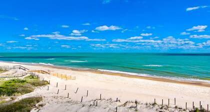 Dog-friendly beachfront home with private hot tub, fireplace, on-site pool, AC