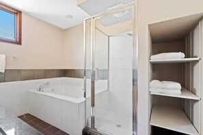 Bathtub, jetted tub, hair dryer, towels