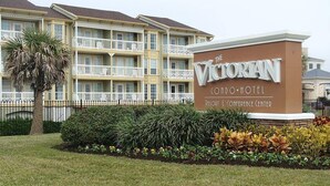 A sign for The Victorian Condo Hotel, indicating it is a resort and conference center. - Cute ocean view beach front condo w private balcony . Great LOCATION! Sleeps 6. (Galveston)