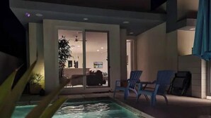 A swimming pool with chairs and a ceiling fan. - Desert Modern 4BR: Pool, Spa & Mtn views #259142 (La Quinta)