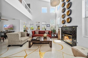 Smart TV, fireplace, books, offices