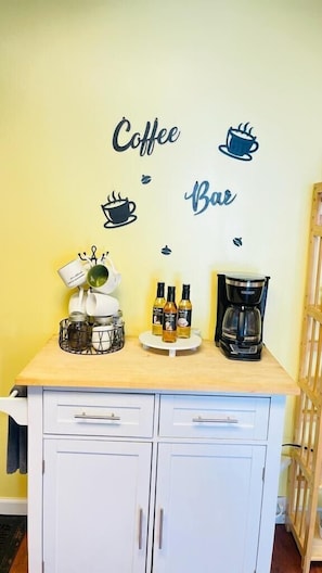Enjoy a morning pick-me-up in this kitchenette, equipped with a coffee maker, kettle, and coffee selection.