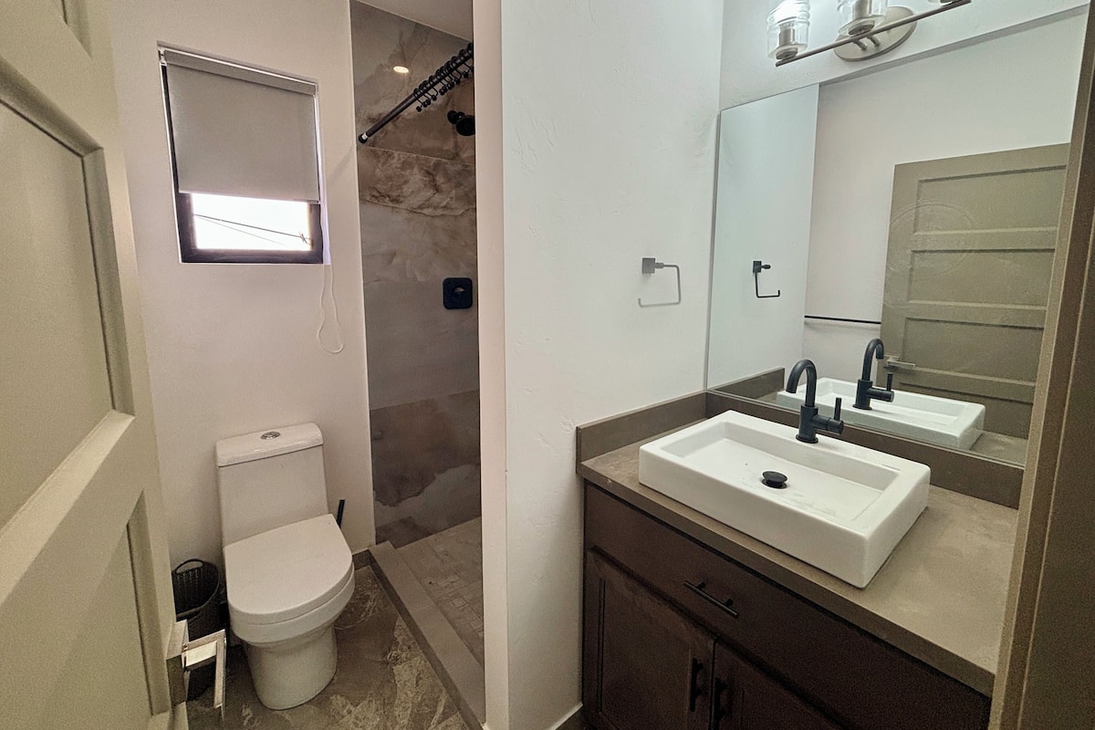 Design Quadruple Room | Bathroom | Shower, hair dryer, towels, soap