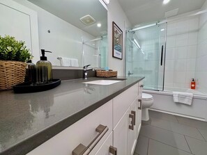 Granite Ridge Condo | Bathroom | Hair dryer, heated floors, towels, shampoo - Granite Ridge Condo by Revelstoke Vacations (Revelstoke)