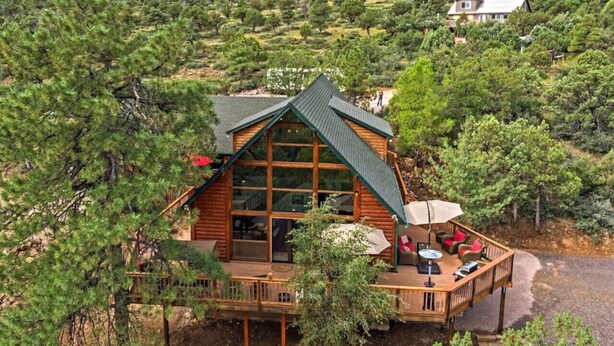 A log cabin with a large deck and a covered outdoor seating area. - Trailheads Steps Away + Stunning Views! (Pine)