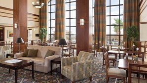 A spacious lobby with high ceilings, large windows, and a variety of seating arrangements including sofas and chairs. - 2 Bedrooms | Free Daily Breakfast, Outdoor Pool (El Paso)