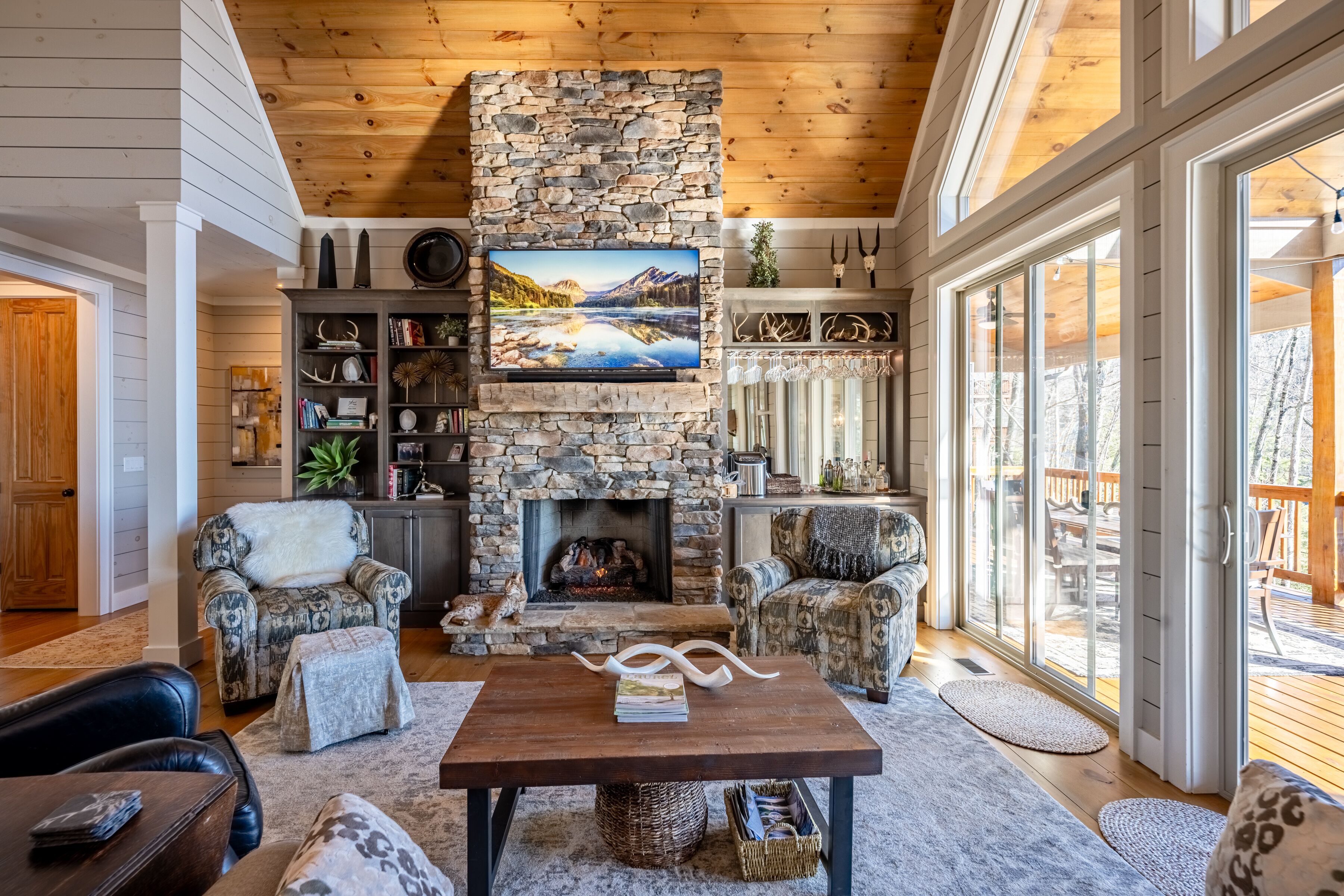 Living room offers guests a smart TV, gas fireplace, and a bar area.
