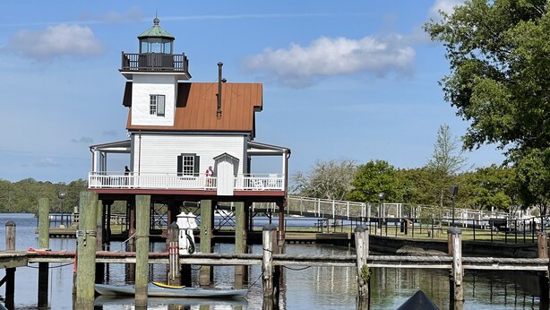 A lighthouse on stilts over water, with a balcony and a small tower. -  Cape Cod cottage close to Prembroke Creek (Edenton)