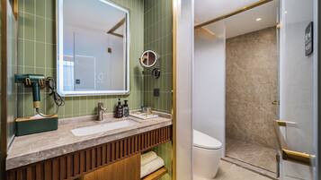 Shower, rainfall showerhead, designer toiletries, hair dryer