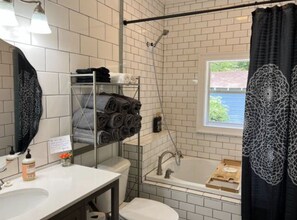 Combined shower/tub, hair dryer, towels, soap