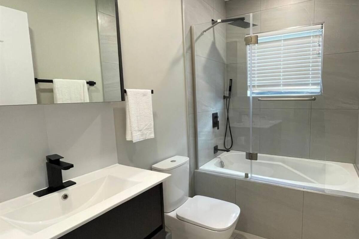business condo, 1 queen bed | bathroom | combined shower/bathtub, free toiletries, towels